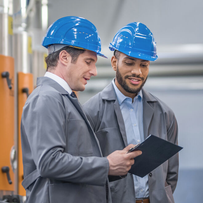 Engineers discussing in factory